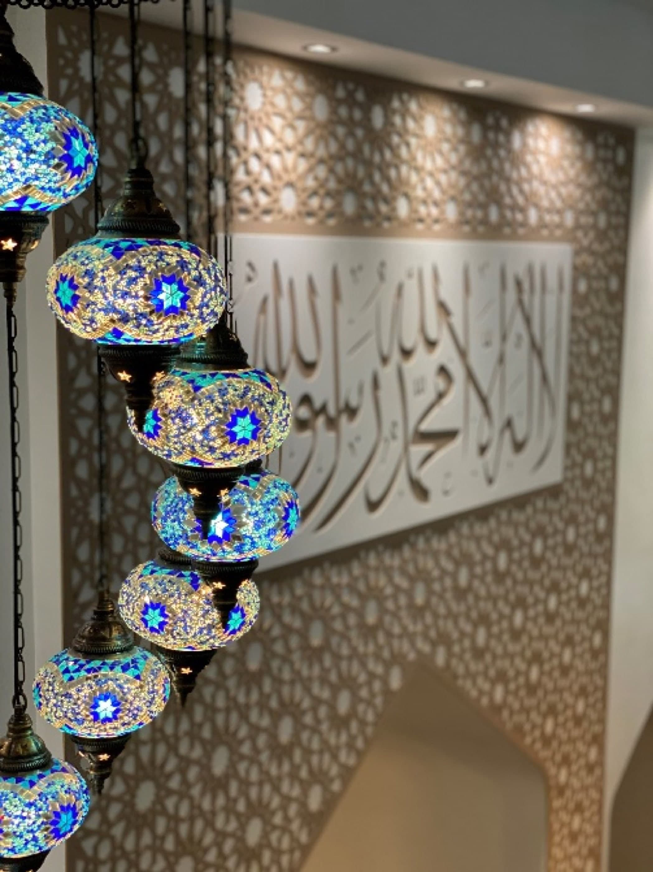 Qur'anic calligraphy in an ornate mosque interior